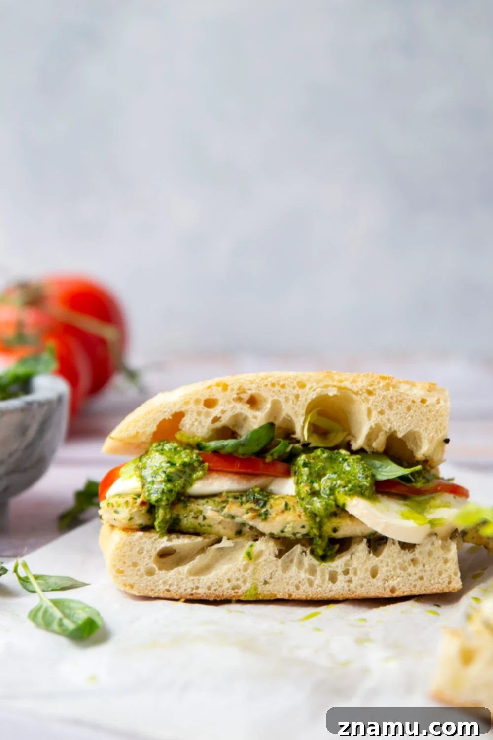 These sandwiches feature smoky pesto grilled chicken sandwiched between soft ciabatta bread with lots of fresh tomato and mozzarella.