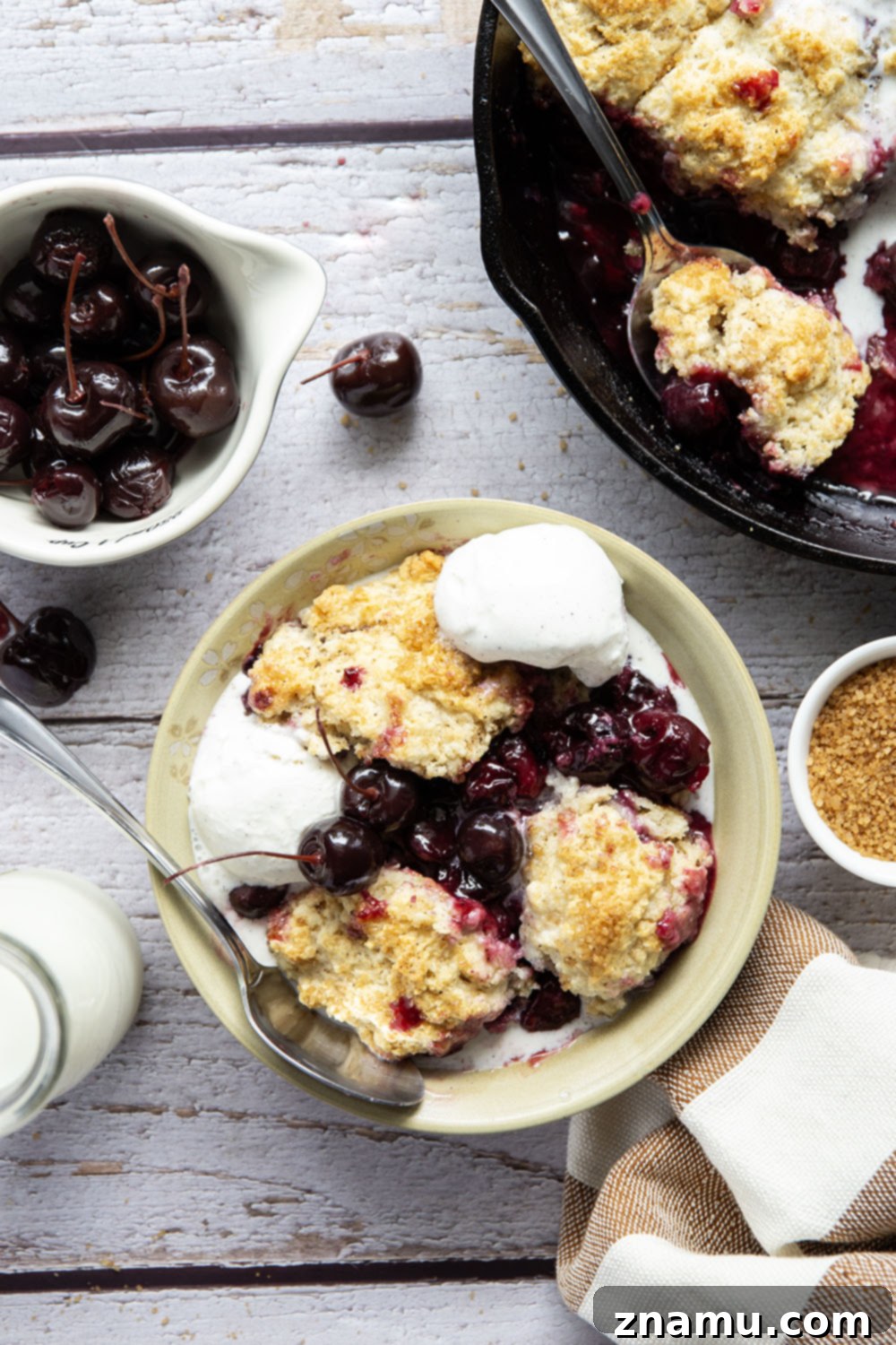 Sweet Cherry & Toasted Butter Cobbler 4 Overhead view of a baked browned butter cherry cobbler, ready to be served.