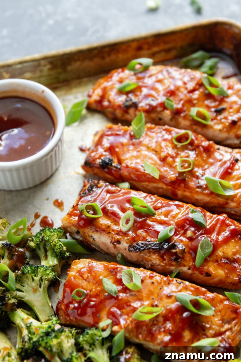Smoky BBQ Salmon with Crisp Broccoli 3 Brushed in a sweet homemade barbecue sauce and grilled alongside broccoli, this grilled BBQ salmon is ready in only 30 minutes and great served alongside steamed rice.