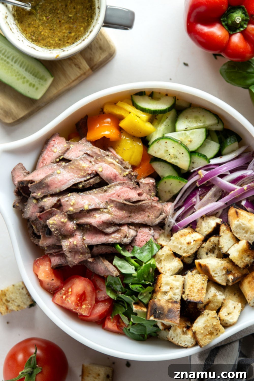 Savory Grilled Steak Panzanella 3 Juicy grilled steak, charred bread cubes, juicy tomatoes, and lots of fresh basil make for the perfect summery meal in this grilled steak panzanella salad.