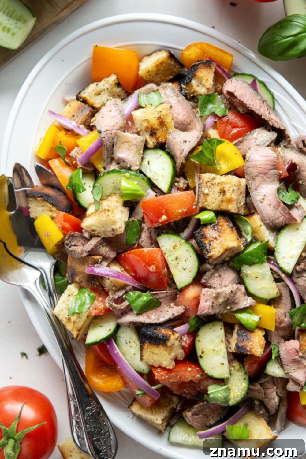 Savory Grilled Steak Panzanella 5 Juicy grilled steak, charred bread cubes, juicy tomatoes, and lots of fresh basil make for the perfect summery meal in this grilled steak panzanella salad.