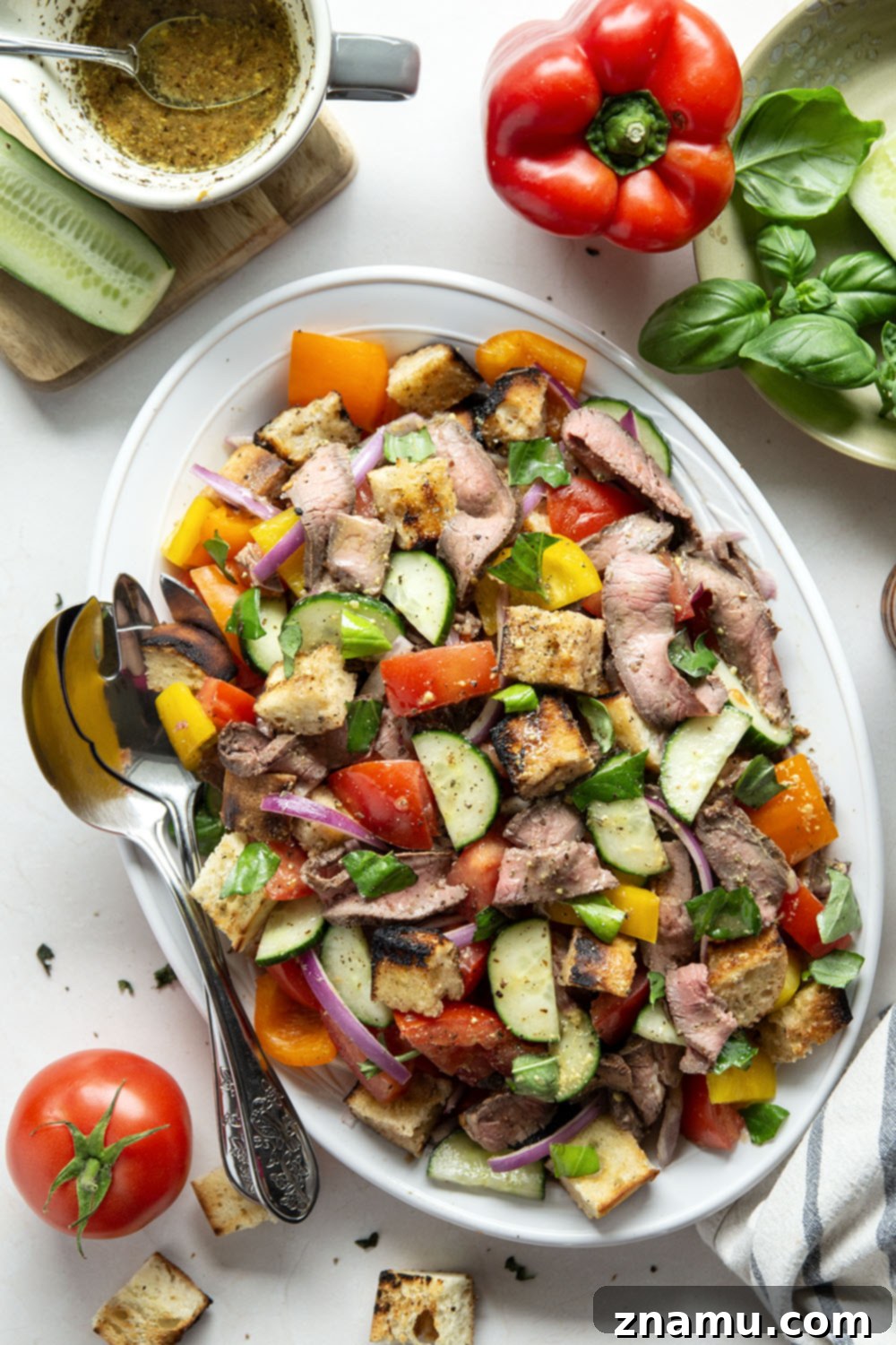 Savory Grilled Steak Panzanella 6 Juicy grilled steak, charred bread cubes, juicy tomatoes, and lots of fresh basil make for the perfect summery meal in this grilled steak panzanella salad.
