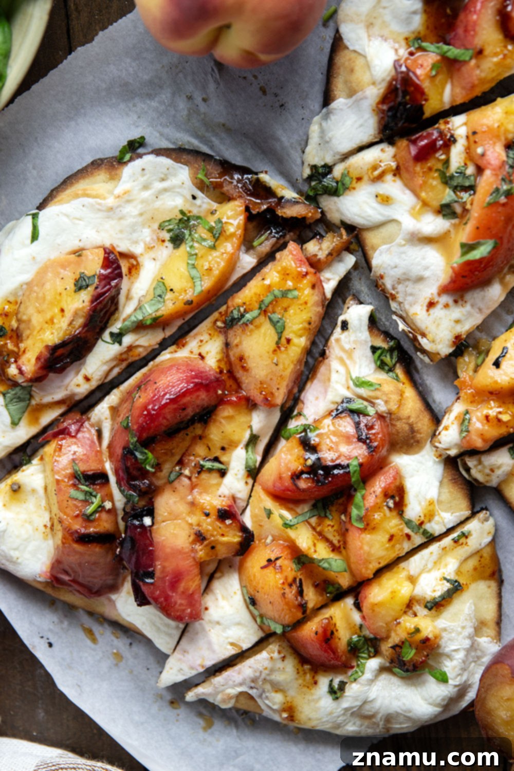 Blistered Peach & Hot Honey Flatbread 4 Smoky grilled peaches and drizzles of sweet and spicy homemade hot honey sauce are the perfect duo in this grilled peach flatbread.