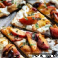Blistered Peach & Hot Honey Flatbread 8 Smoky grilled peaches and drizzles of sweet and spicy homemade hot honey sauce are the perfect duo in this grilled peach flatbread.