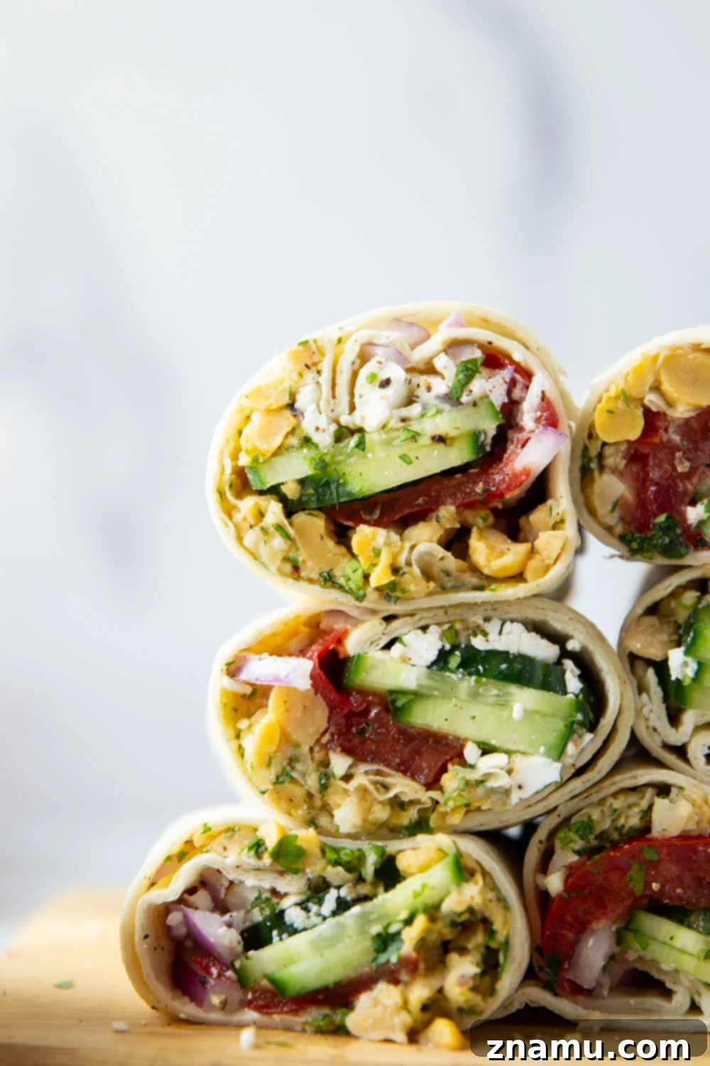 Sun-Drenched Chickpea Roll 2 Lemony herb smashed chickpeas and lots of fresh Mediterranean ingredients make for the best lunch in this Mediterranean chickpea wrap.