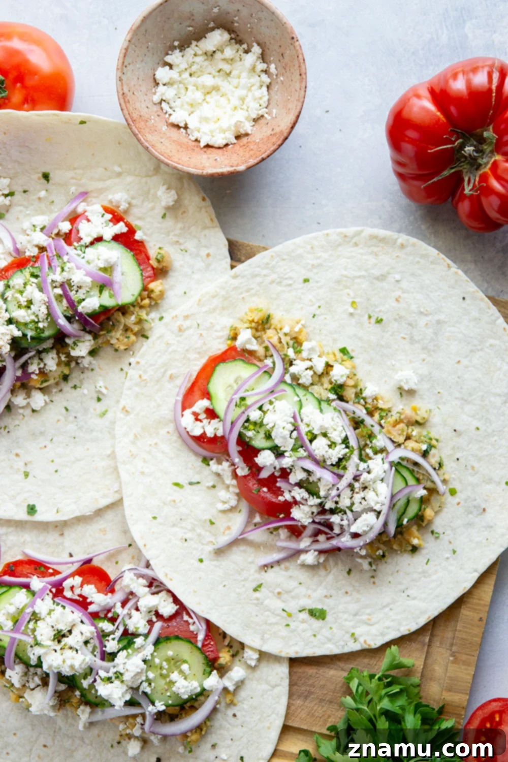 Sun-Drenched Chickpea Roll 4 Lemony herb smashed chickpeas and lots of fresh Mediterranean ingredients make for the best lunch in this Mediterranean chickpea wrap.