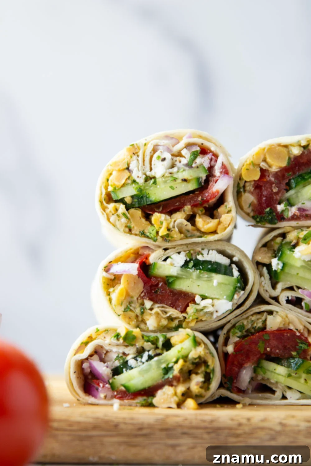Sun-Drenched Chickpea Roll 5 Lemony herb smashed chickpeas and lots of fresh Mediterranean ingredients make for the best lunch in this Mediterranean chickpea wrap.