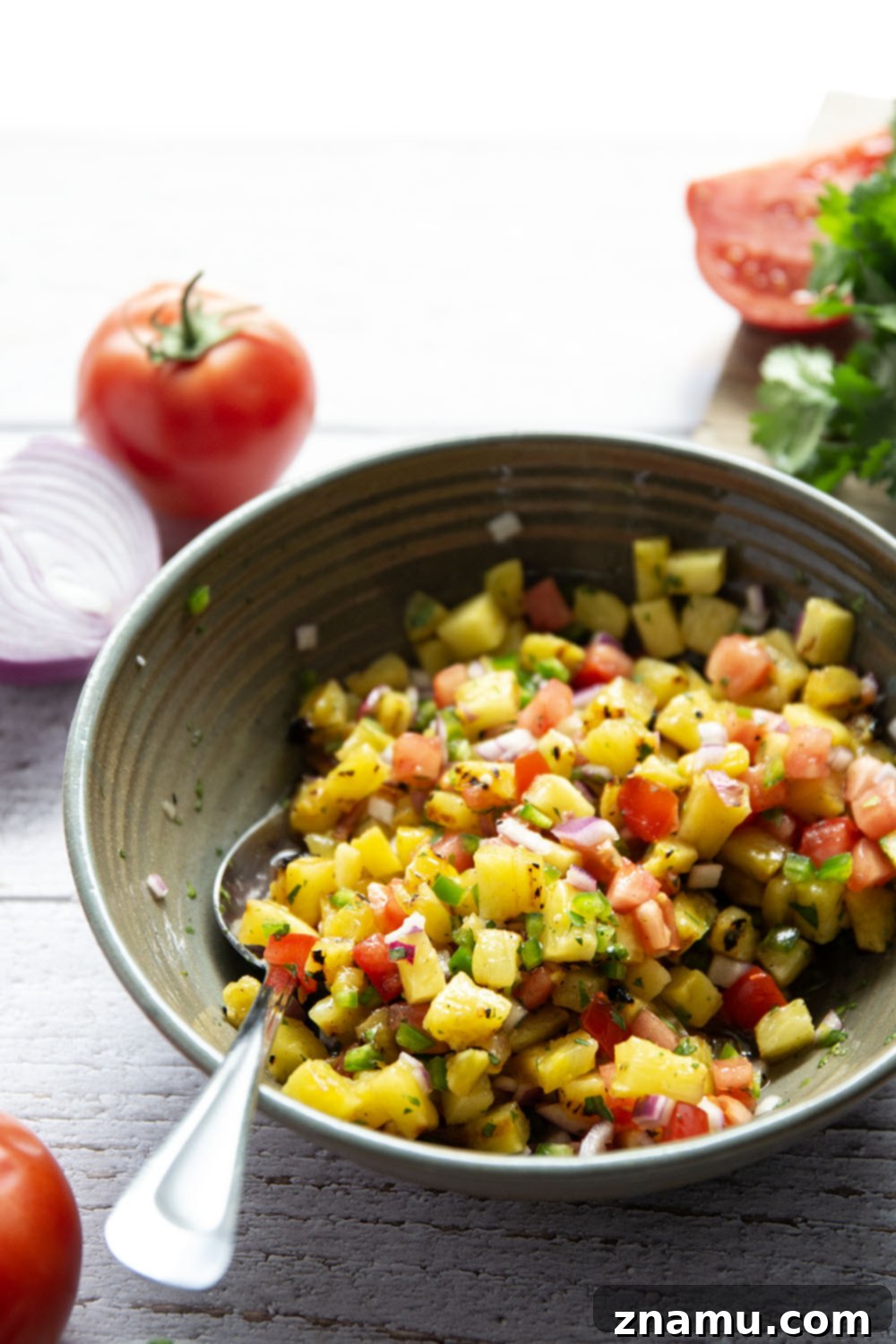 Tropical Jerk Cod with Sweet Pineapple Salsa 4 Cooked Jerk Cod fillet topped with generous smoky grilled pineapple salsa, ready to serve.