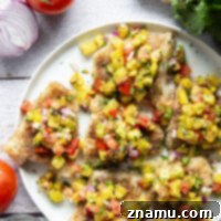 This jerk cod features a homemade jerk seasoning mix rubbed all over cod fillets, grilled to perfection, and topped with a smoky grilled pineapple salsa.