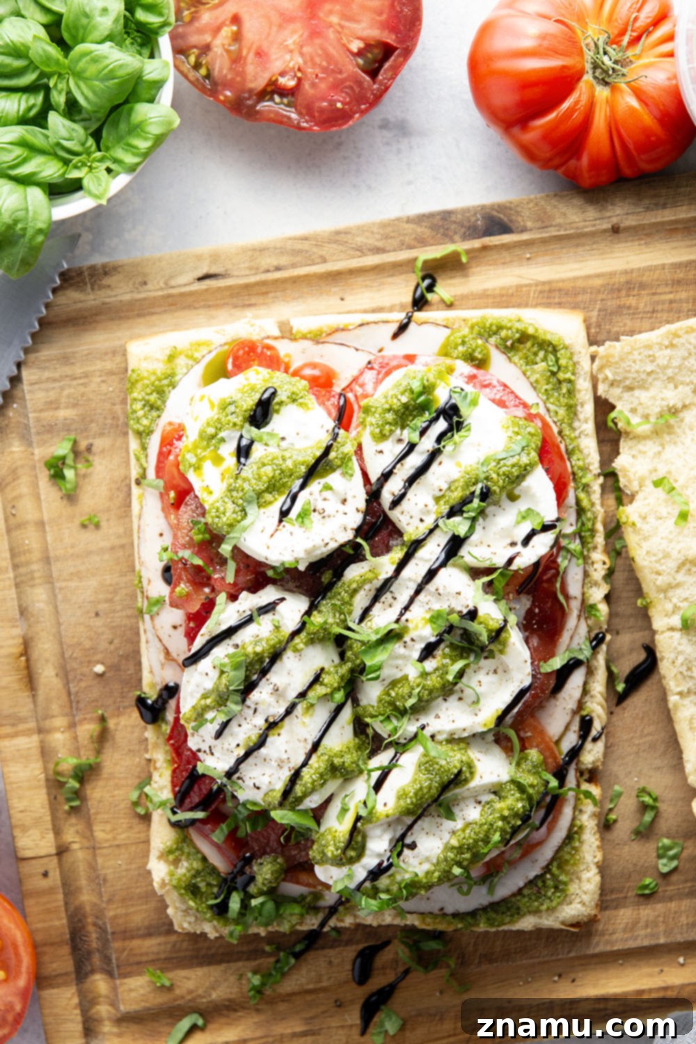 Fresh Pesto Turkey Caprese Sliders 3 Close-up of freshly assembled Pesto Turkey Caprese Sliders, showcasing the layers of ingredients.