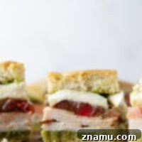 Fresh Pesto Turkey Caprese Sliders 8 Pesto Turkey Caprese Sliders with all ingredients visible.