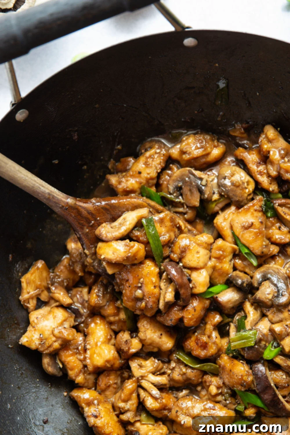 Close-up of cubed chicken thighs ready for stir frying