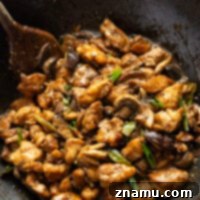 Black Pepper Mushroom Chicken Stir Fry in a wok