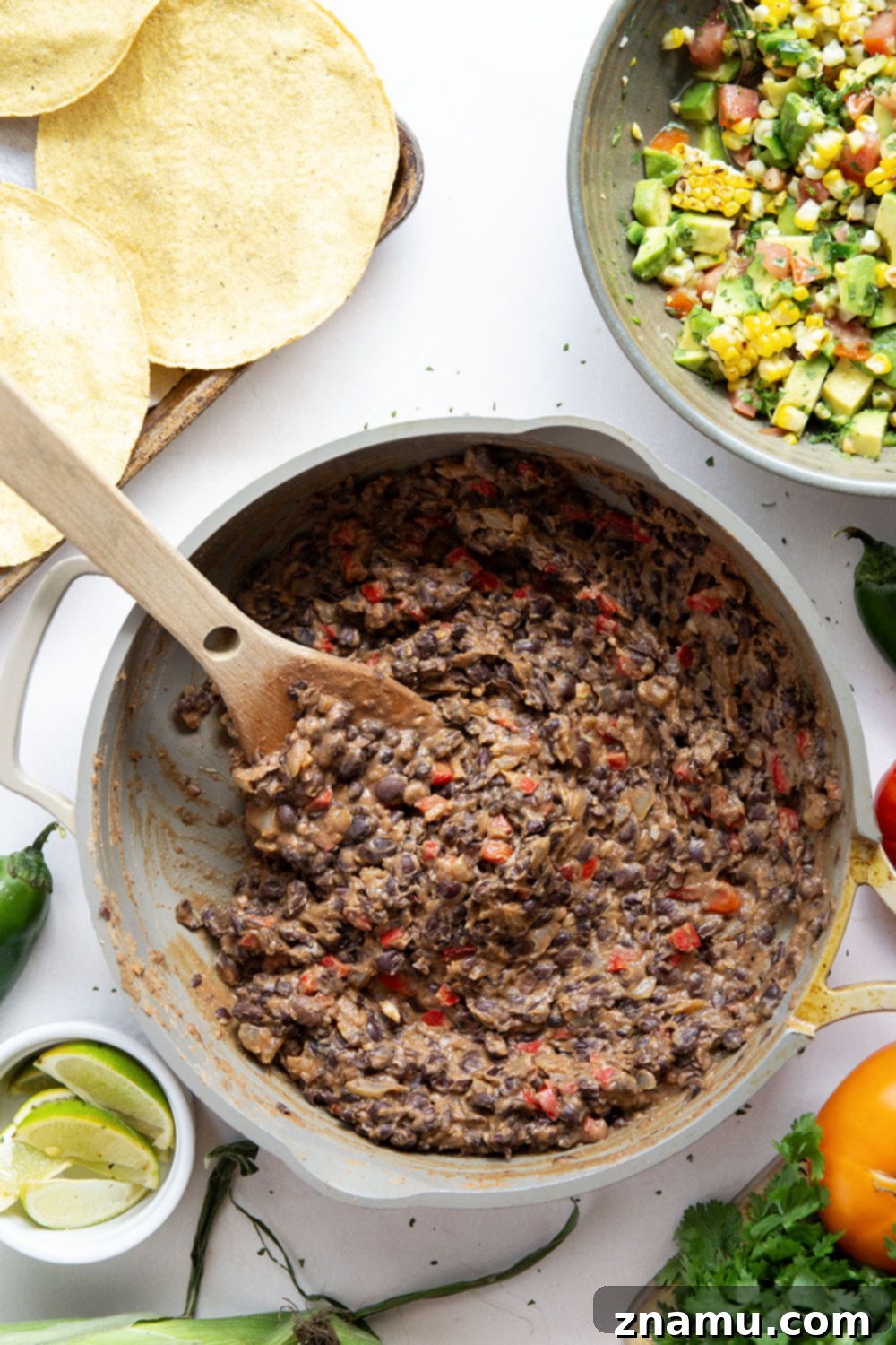 Summer Black Bean Tostadas with Smoky Corn Salsa 3 Creamy smashed black beans and a smoky grilled corn avocado salsa are piled onto these massively flavorful black bean tostadas for an easy vegetarian or vegan meal.