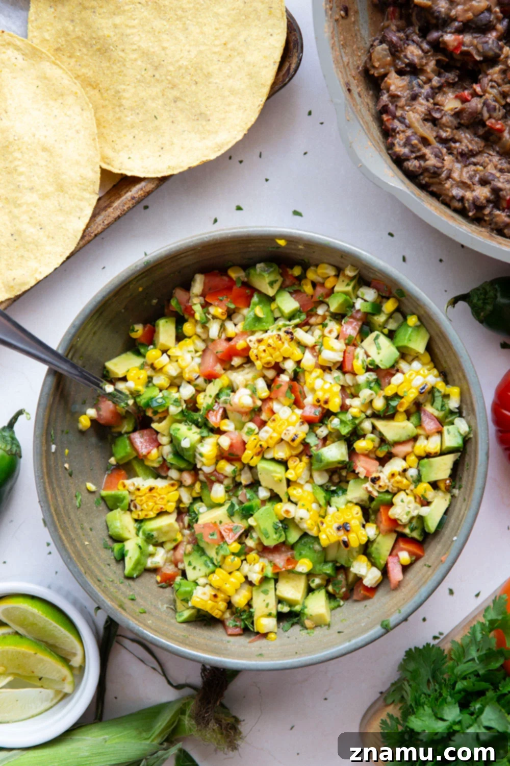 Summer Black Bean Tostadas with Smoky Corn Salsa 4 Creamy smashed black beans and a smoky grilled corn avocado salsa are piled onto these massively flavorful black bean tostadas for an easy vegetarian or vegan meal.