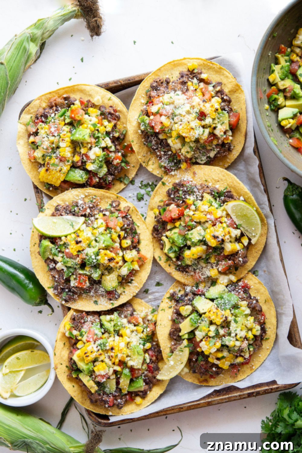 Summer Black Bean Tostadas with Smoky Corn Salsa 5 Creamy smashed black beans and a smoky grilled corn avocado salsa are piled onto these massively flavorful black bean tostadas for an easy vegetarian or vegan meal.