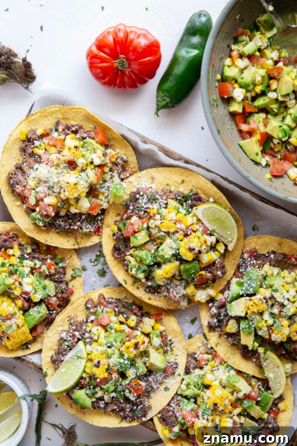 Summer Black Bean Tostadas with Smoky Corn Salsa 6 Creamy smashed black beans and a smoky grilled corn avocado salsa are piled onto these massively flavorful black bean tostadas for an easy vegetarian or vegan meal.