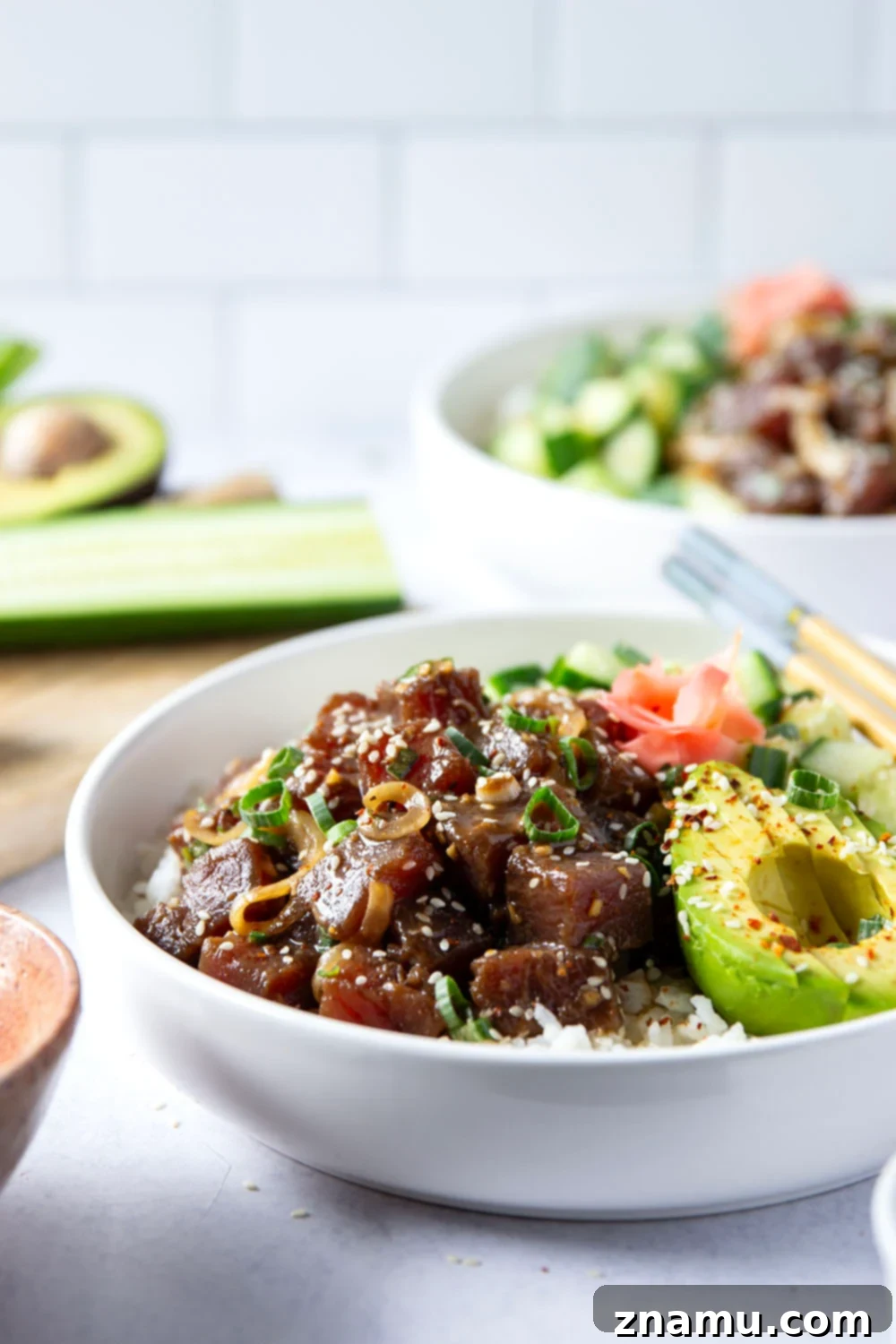 A vibrant Ahi Tuna Poke Bowl, artfully presented with fresh ingredients and garnished beautifully