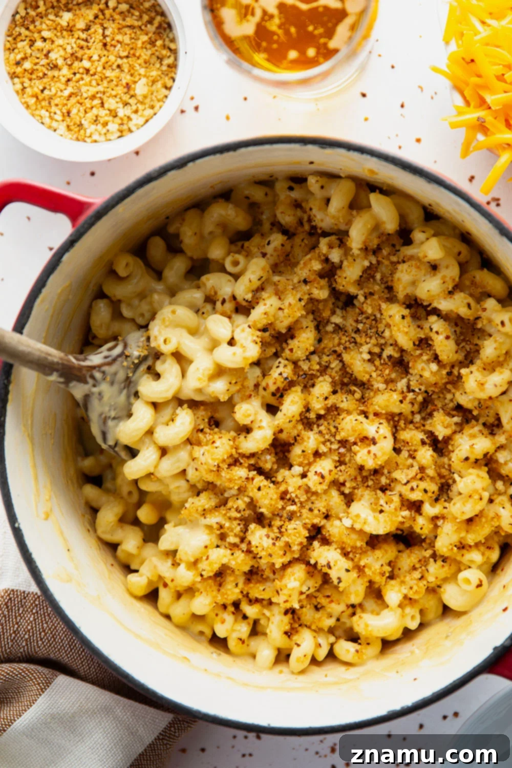 Crispy Chili Crumb Beer Cheese Mac & Cheese 3 A gooey cheddar gouda beer sauce coats every inch of tender pasta in this beer mac and cheese while spicy breadcrumbs on top finish it off perfectly.