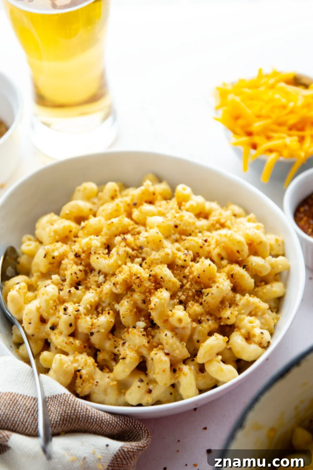 Crispy Chili Crumb Beer Cheese Mac & Cheese 4 A gooey cheddar gouda beer sauce coats every inch of tender pasta in this beer mac and cheese while spicy breadcrumbs on top finish it off perfectly.