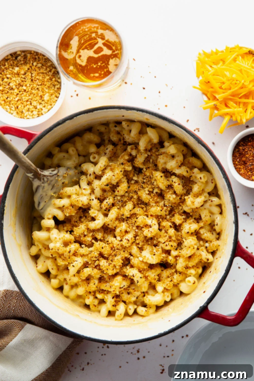 Crispy Chili Crumb Beer Cheese Mac & Cheese 5 A gooey cheddar gouda beer sauce coats every inch of tender pasta in this beer mac and cheese while spicy breadcrumbs on top finish it off perfectly.