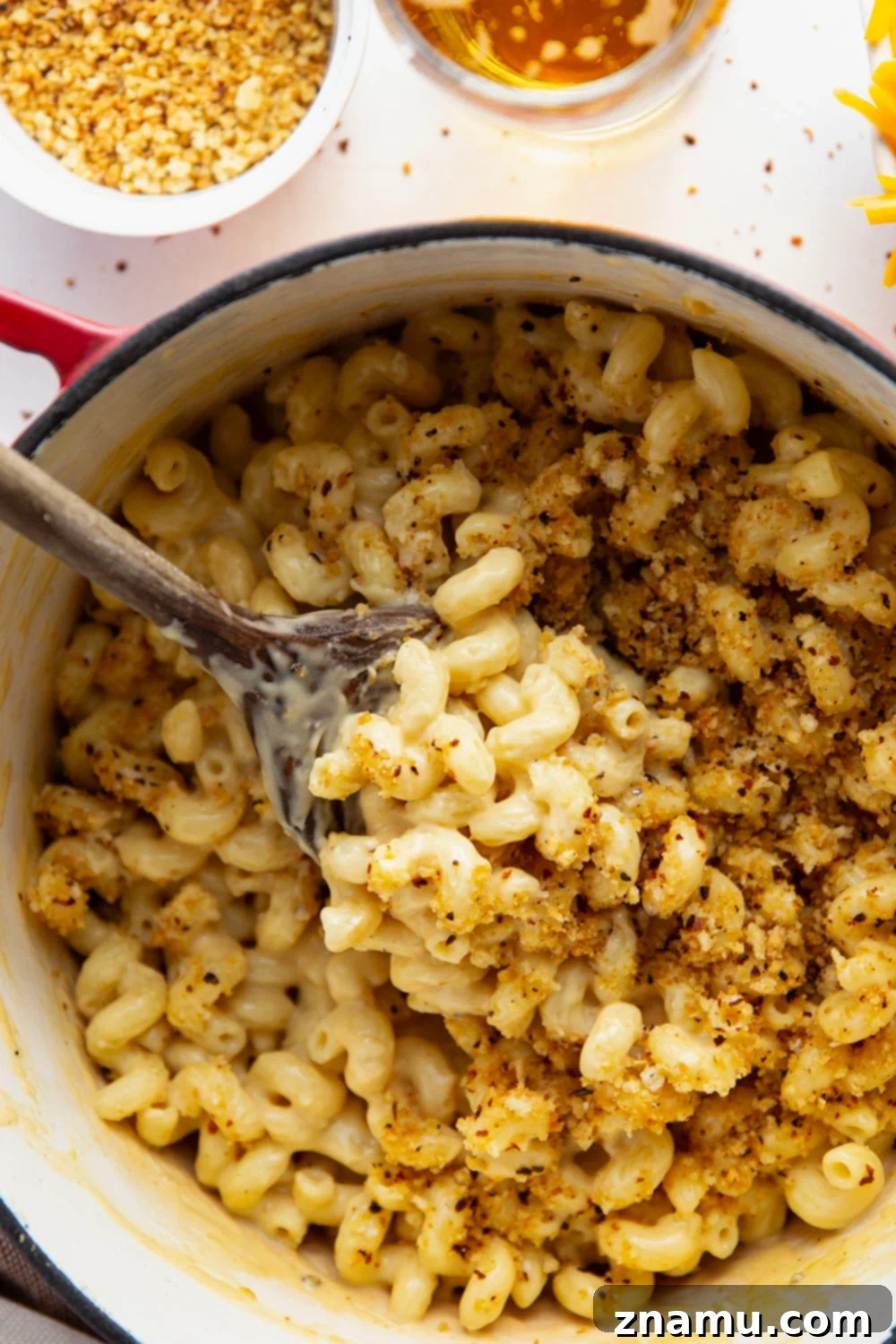 Crispy Chili Crumb Beer Cheese Mac & Cheese 6 A gooey cheddar gouda beer sauce coats every inch of tender pasta in this beer mac and cheese while spicy breadcrumbs on top finish it off perfectly.
