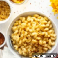 Crispy Chili Crumb Beer Cheese Mac & Cheese 7 A gooey cheddar gouda beer sauce coats every inch of tender pasta in this beer mac and cheese while spicy breadcrumbs on top finish it off perfectly.