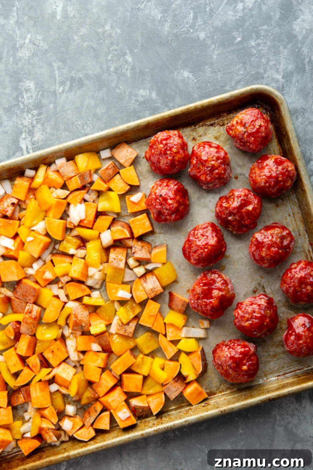 Baked in minutes on only one sheet pan, these honey BBQ meatballs are coated in a sweet and tangy homemade honey BBQ sauce and roasted alongside tender sweet potatoes.