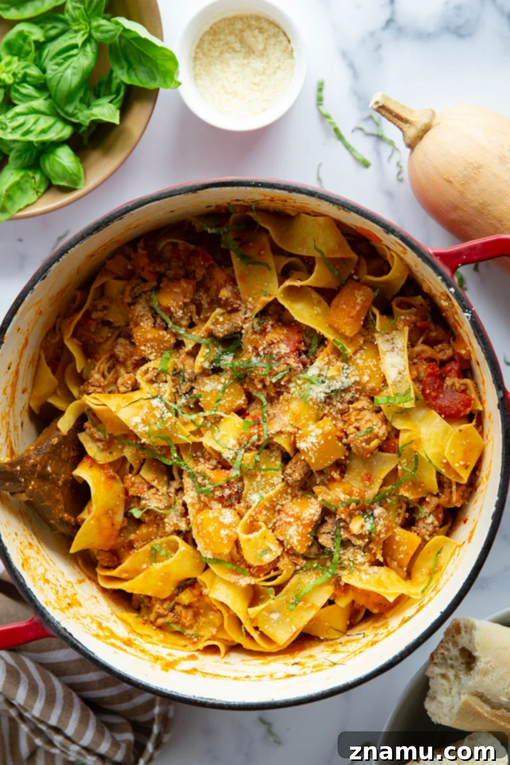 Golden Butternut Turkey Ragu 4 Serving of Butternut Squash Turkey Bolognese in a bowl with fresh herbs.