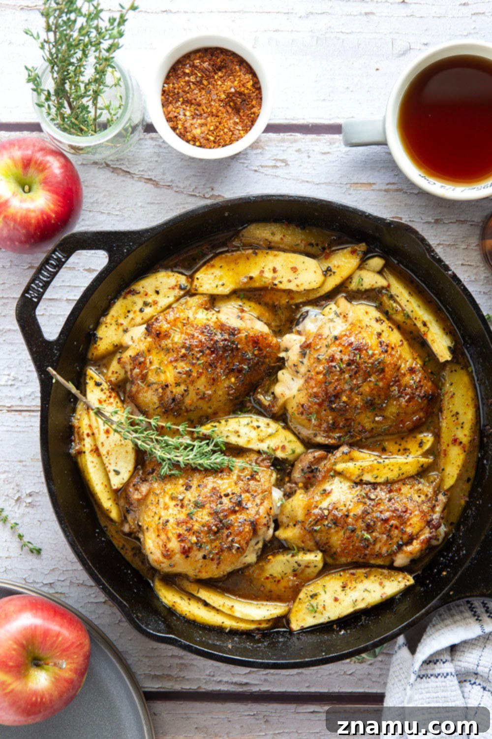 Maple Chili Glazed Chicken Thighs with Apples 3 Baked alongside tender fall apples in a sweet and spicy chili maple glaze, these maple chicken thighs are a quick and flavorful fall dinner for any occasion.