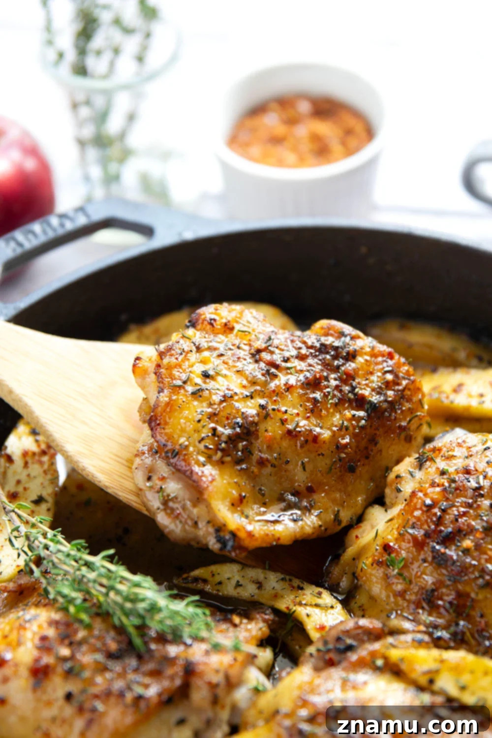 Maple Chili Glazed Chicken Thighs with Apples 4 Baked alongside tender fall apples in a sweet and spicy chili maple glaze, these maple chicken thighs are a quick and flavorful fall dinner for any occasion.
