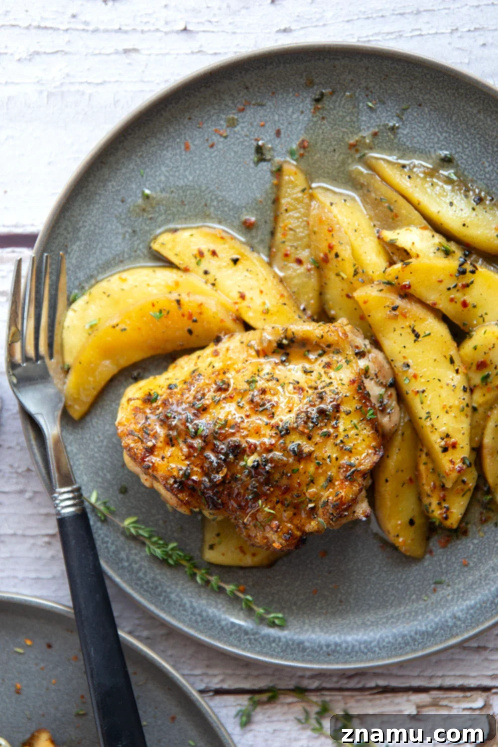 Maple Chili Glazed Chicken Thighs with Apples 6 Baked alongside tender fall apples in a sweet and spicy chili maple glaze, these maple chicken thighs are a quick and flavorful fall dinner for any occasion.