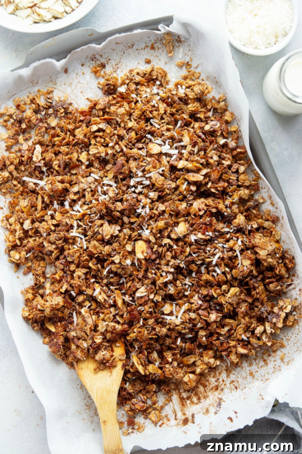 Coconut Almond Chocolate Granola 6 Almond Joy Granola served with Greek yogurt and fresh fruit in a breakfast bowl.