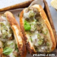 Juicy turkey meatballs are tossed in flavorful basil pesto and baked with lots of gooey havarti cheese in this pesto meatball sandwich.