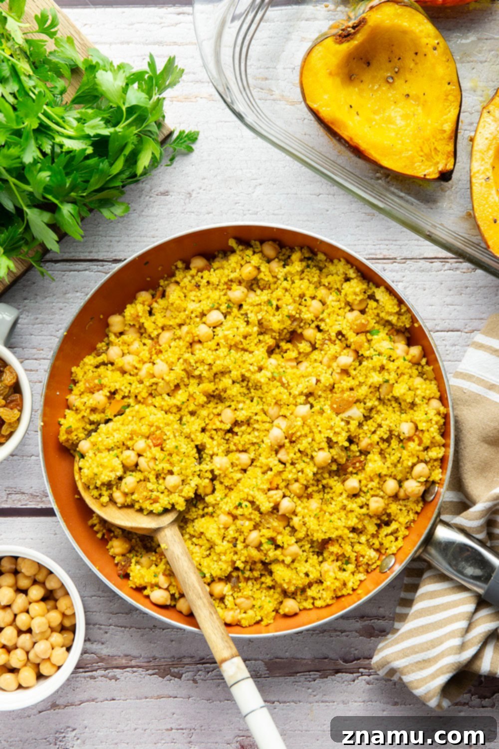Roasted Acorn Squash with Spiced Couscous 3 This couscous stuffed acorn squash features fluffy Moroccan-spiced golden couscous piled into tender acorn squash boats.