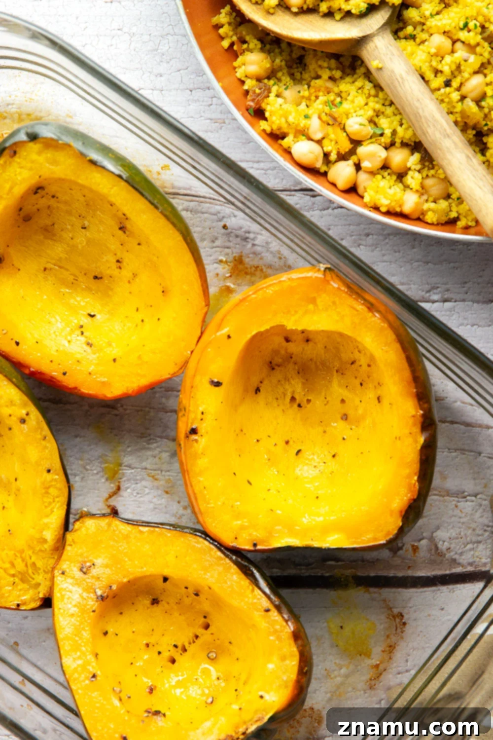 Roasted Acorn Squash with Spiced Couscous 4 This couscous stuffed acorn squash features fluffy Moroccan-spiced golden couscous piled into tender acorn squash boats.