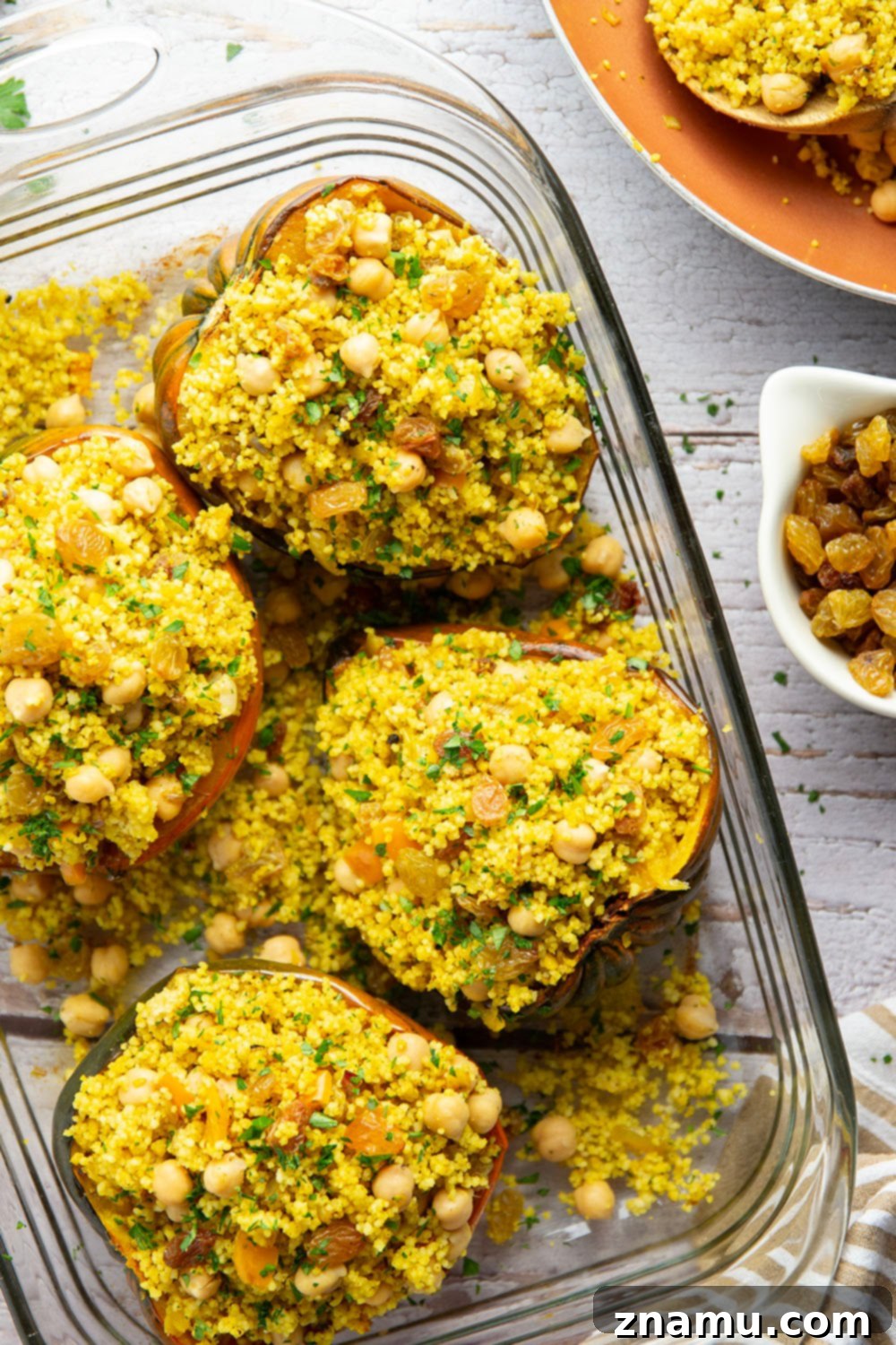 Roasted Acorn Squash with Spiced Couscous 6 This couscous stuffed acorn squash features fluffy Moroccan-spiced golden couscous piled into tender acorn squash boats.