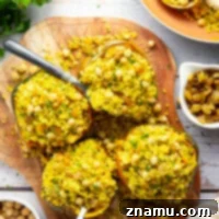 Roasted Acorn Squash with Spiced Couscous 8 This couscous stuffed acorn squash features fluffy Moroccan-spiced golden couscous piled into tender acorn squash boats.