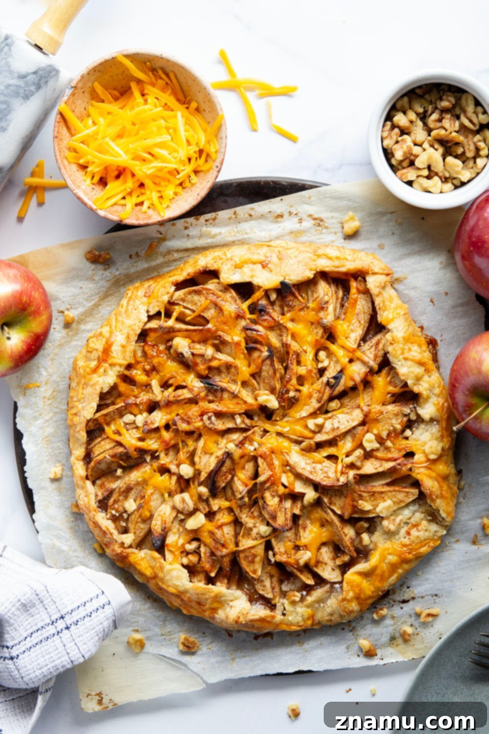 Rustic Apple Cheddar Galette 4 Freshly baked Cheddar Apple Galette, showcasing its free-form, artisanal appearance
