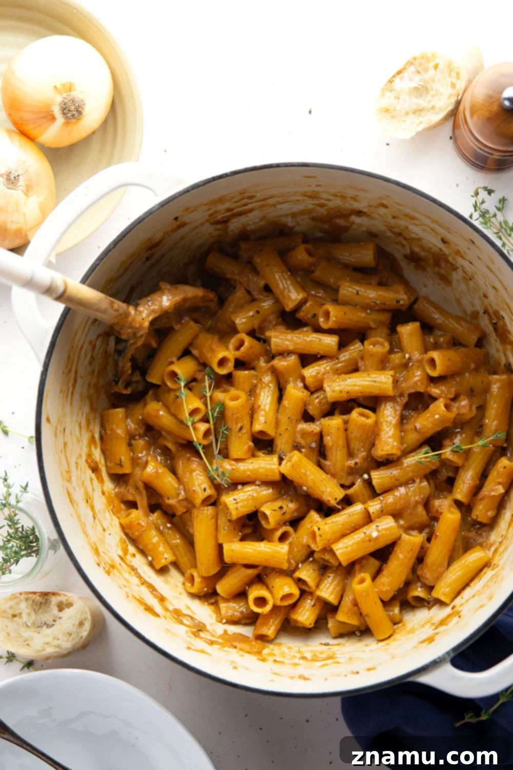 Cheesy One-Pot French Onion Pasta 5 A top-down view of the one-pot French onion soup pasta, freshly made and ready to be served, showing the golden cheese topping and rich sauce.