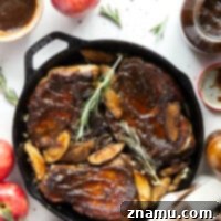 Sticky Apple Butter Pork Chops 8 Glazed Apple Butter Pork Chops with roasted apples and onions.