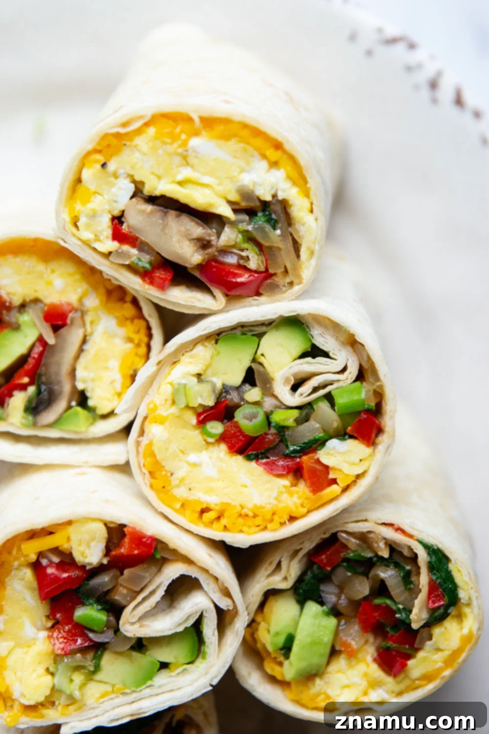Plant-Powered Morning Wraps 6 Jam-packed with sauteed vegetables, scrambled eggs, avocado, and cheddar, these vegetarian breakfast burritos whip up in minutes and are perfect for an on-the-go breakfast!