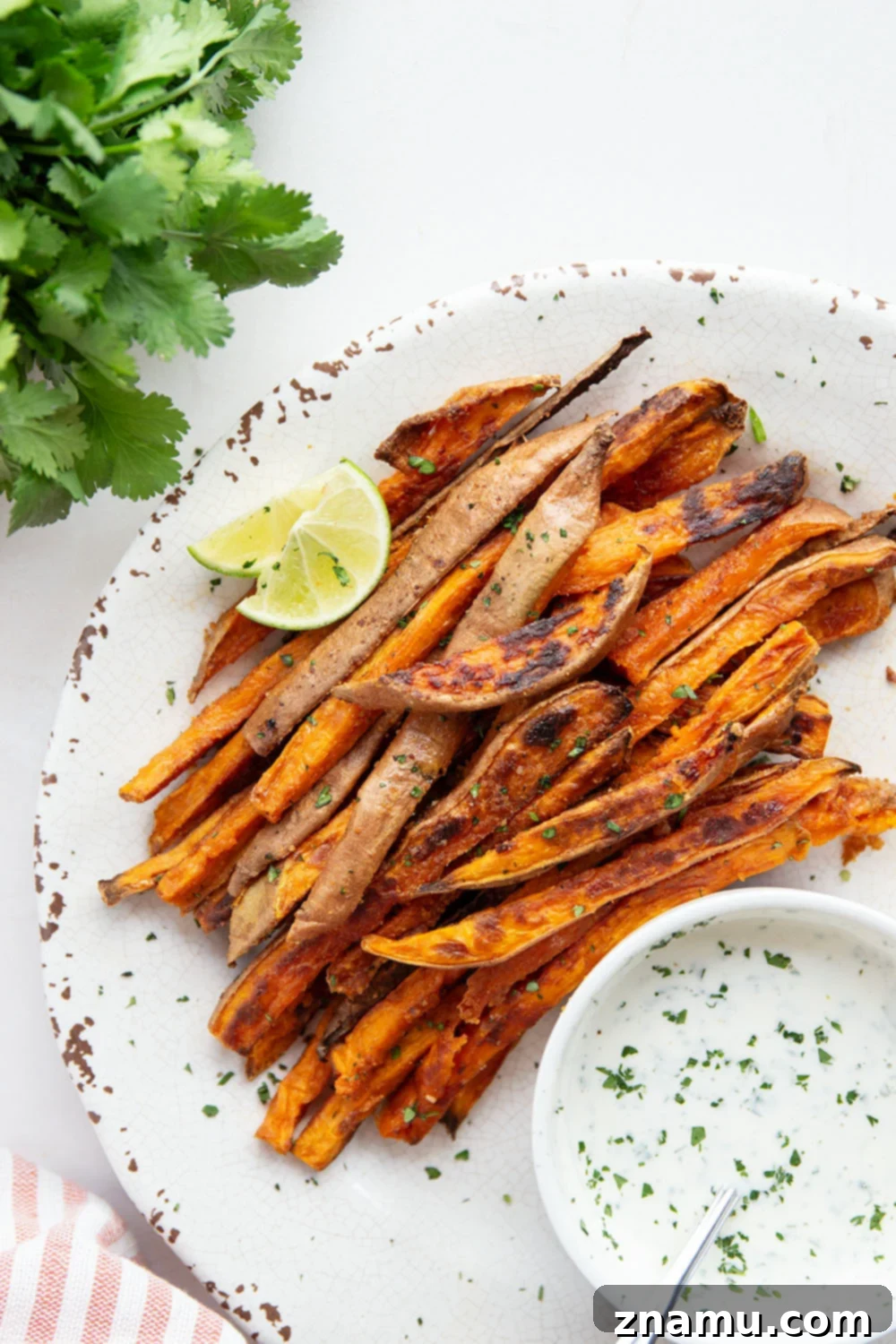 Blazing Sweet Potato Fries with Zesty Cilantro Ranch 2 Sweet and spicy sweet potato fries are perfectly crispy and go incredibly well with a creamy cilantro ranch sauce for dipping.