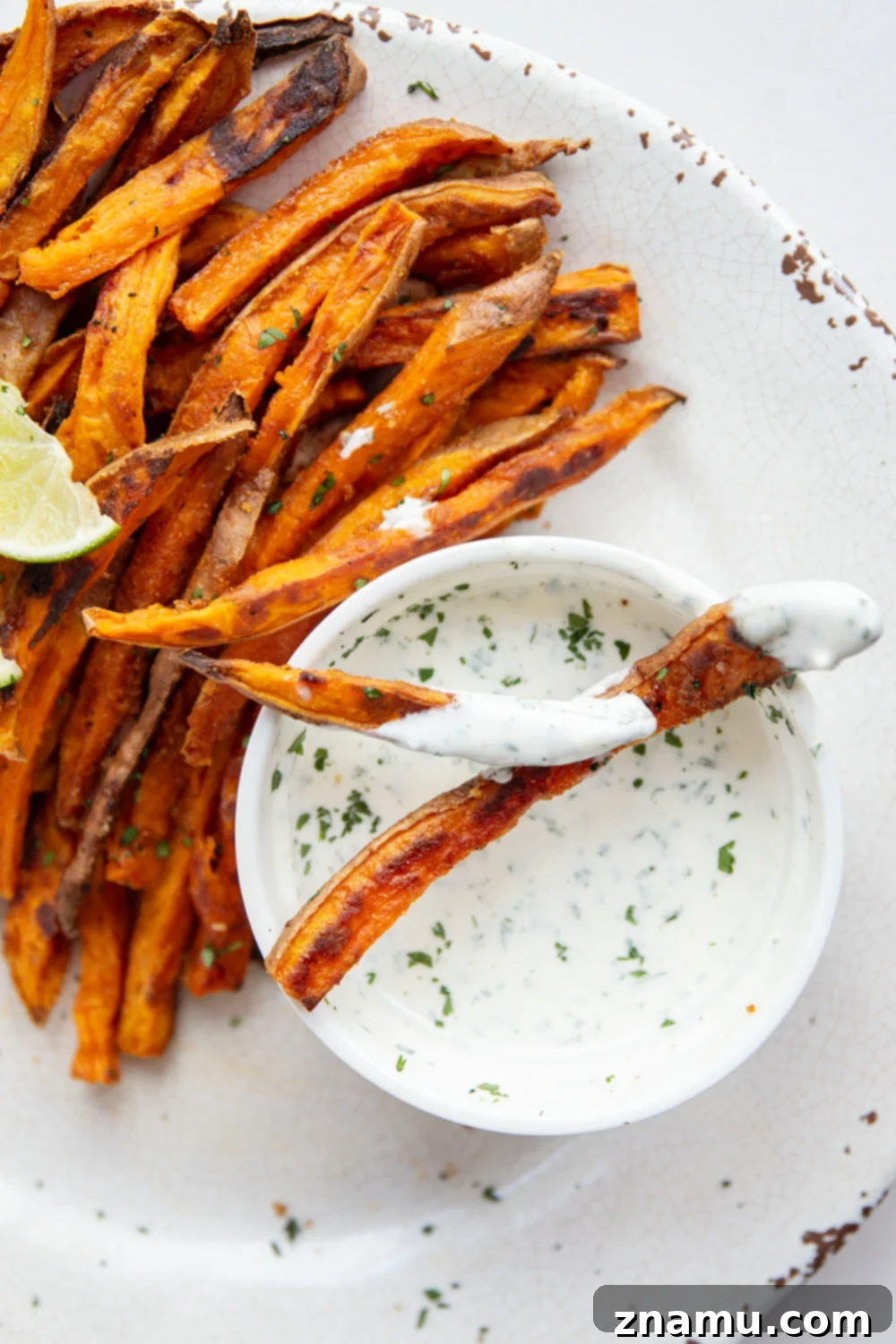 Blazing Sweet Potato Fries with Zesty Cilantro Ranch 5 Sweet and spicy sweet potato fries are perfectly crispy and go incredibly well with a creamy cilantro ranch sauce for dipping.