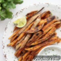 Sweet and spicy sweet potato fries are perfectly crispy and go incredibly well with a creamy cilantro ranch sauce for dipping.