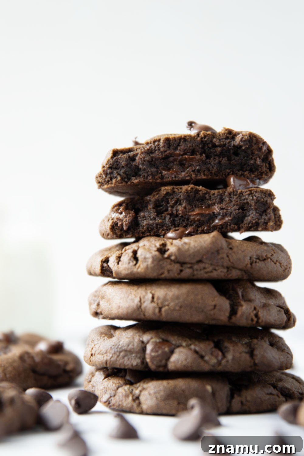 Decadent Double Chocolate Cookies 6 A stack of perfectly baked double chocolate chip cookies, ready to be enjoyed.
