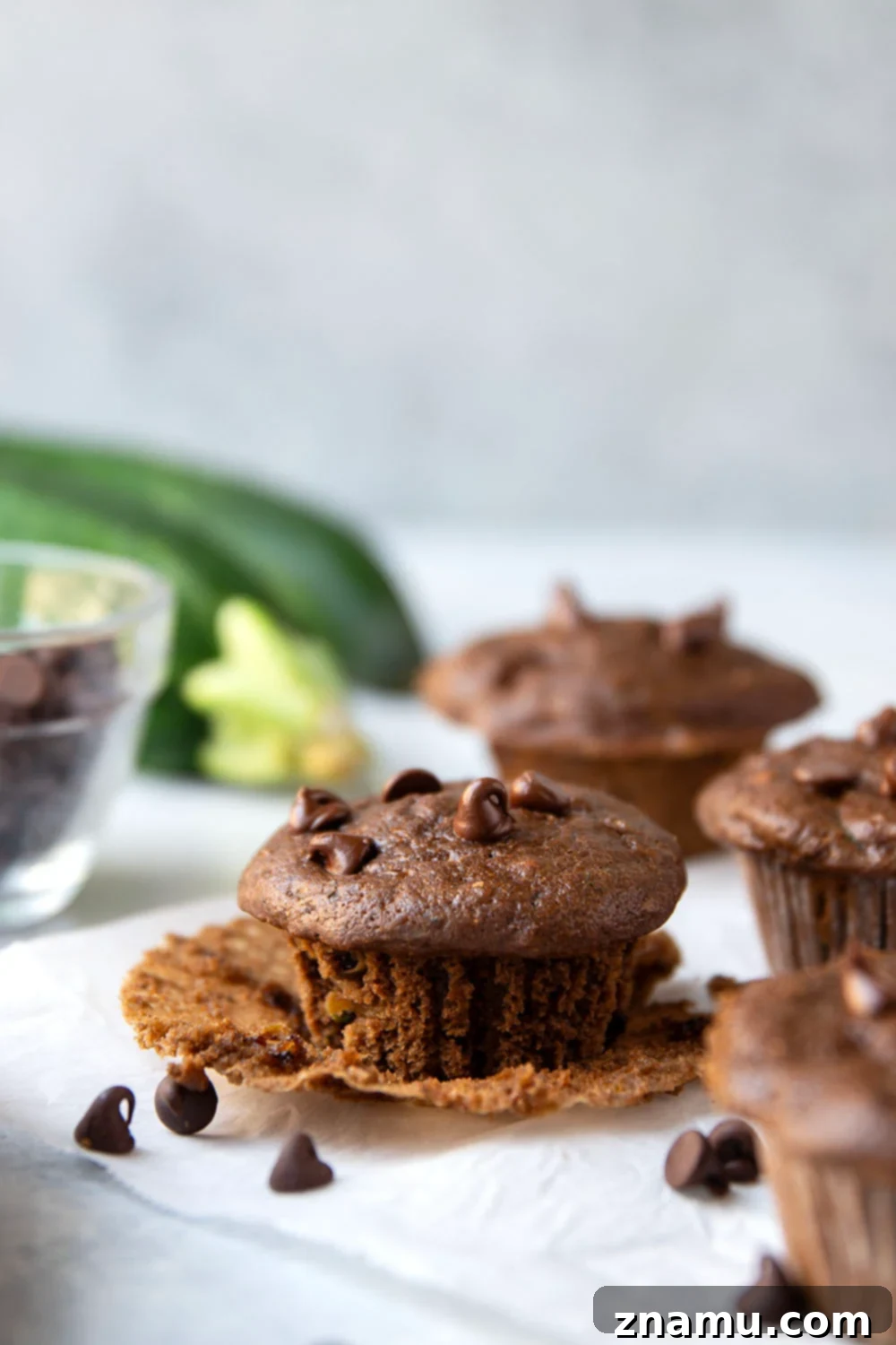 Decadent Double Chocolate Zucchini Muffins 3 Close-up of a stack of fudgy Chocolate Zucchini Muffins