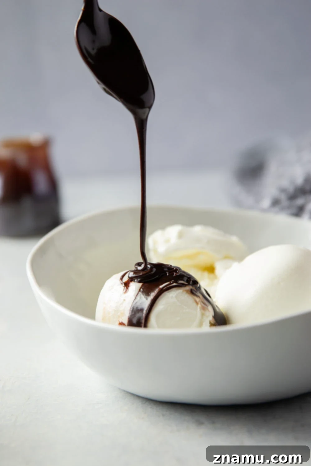 Decadent Homemade Hot Fudge Sauce 3 A close-up of a bowl filled with rich, glossy homemade hot fudge sauce.