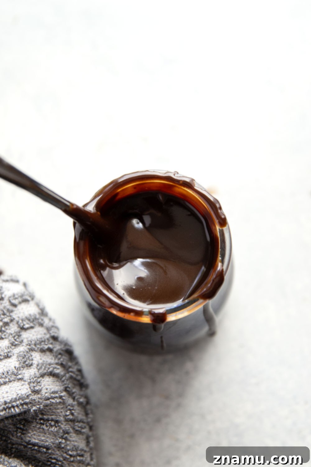Decadent Homemade Hot Fudge Sauce 5 Various high-quality chocolate bars and cocoa powder, key ingredients for homemade hot fudge sauce.