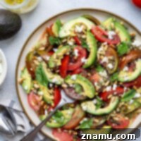 Made with sweet juicy tomatoes and silky avocado with a tangy vinaigrette and lots of fresh basil on top, this avocado tomato salad is a simple summer salad that elevates any meal!
